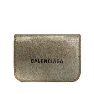 Balenciaga, gold leather wallet with two compartments and a snap close change purse & tri-fold wallet