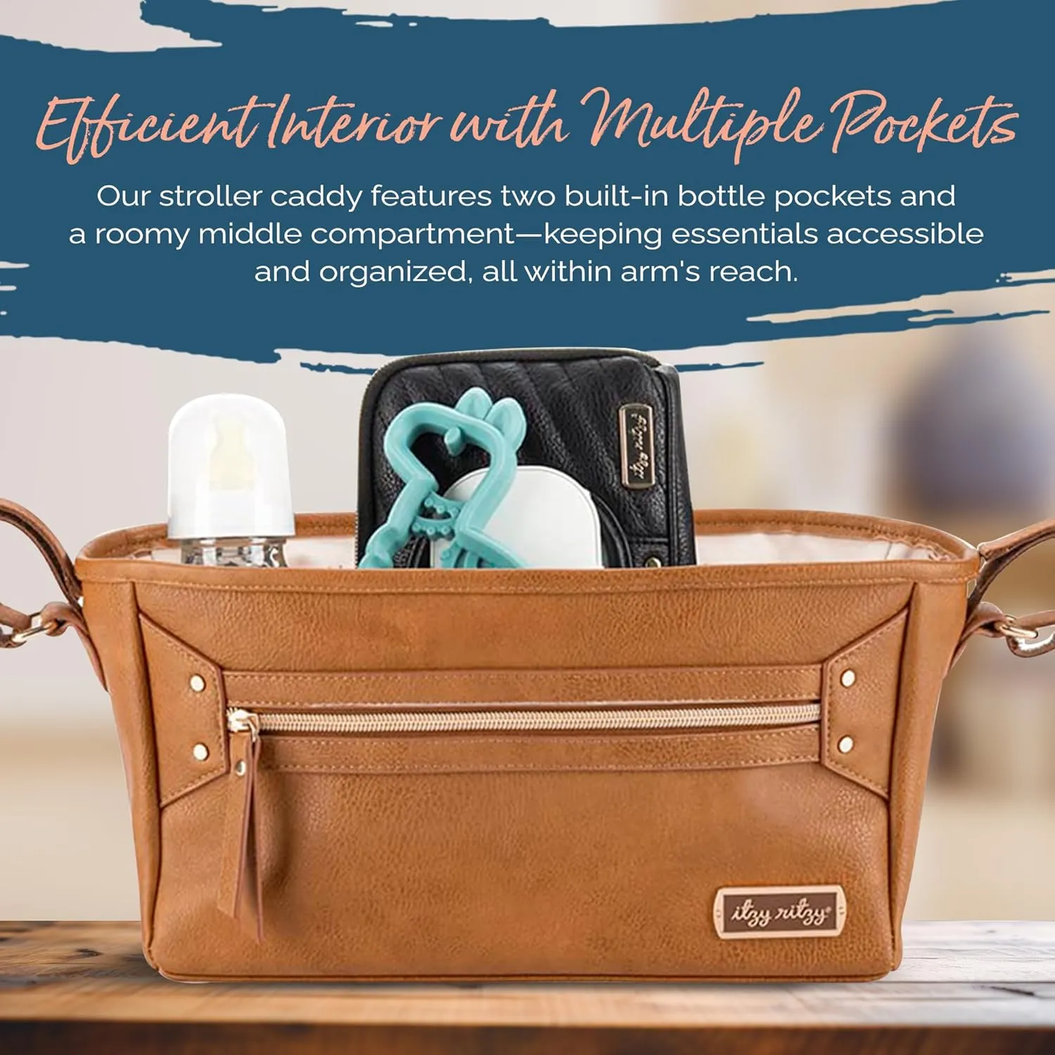 Itzy Ritzy Adjustable Stroller Caddy and Organizer Bag Featuring Front Zippered Pocket, 2 Built-in Interior Pockets & Adjustable Straps to Fit Nearly Any Stroller (Cognac)