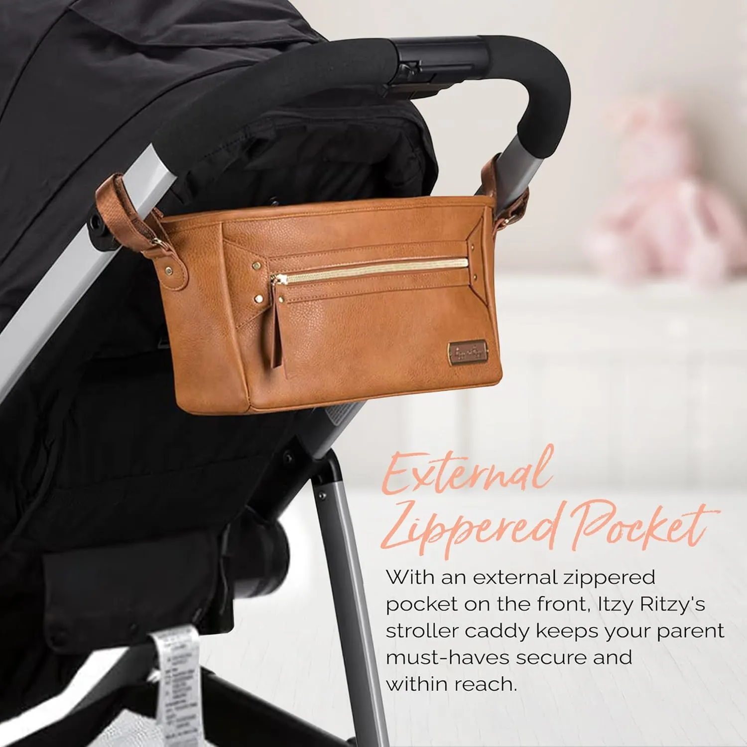Itzy Ritzy Adjustable Stroller Caddy and Organizer Bag Featuring Front Zippered Pocket, 2 Built-in Interior Pockets & Adjustable Straps to Fit Nearly Any Stroller (Cognac)