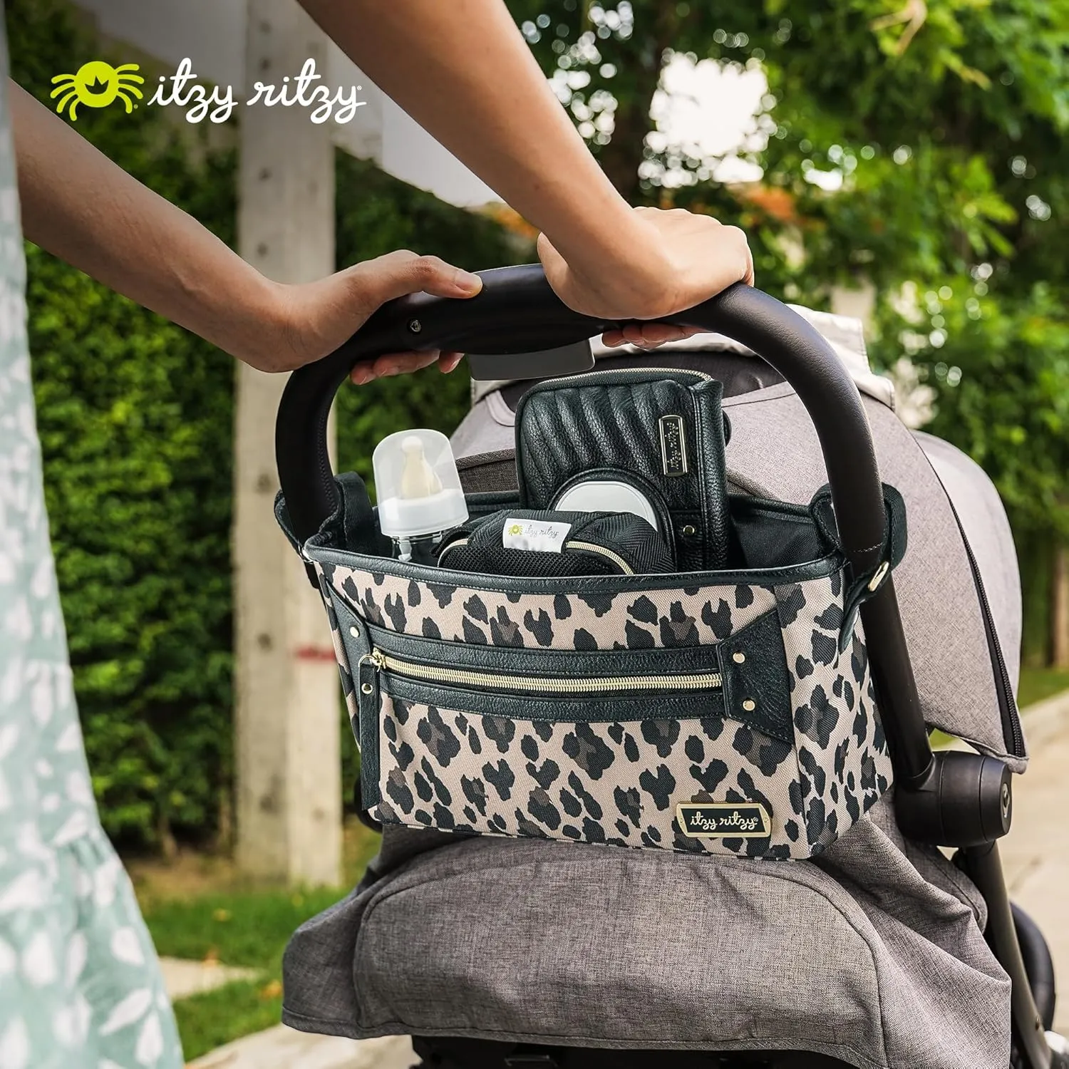 Itzy Ritzy Adjustable Stroller Caddy and Organizer Bag Featuring Front Zippered Pocket, 2 Built-In Interior Pockets & Adjustable Straps to Fit Nearly Any Stroller (Leopard)