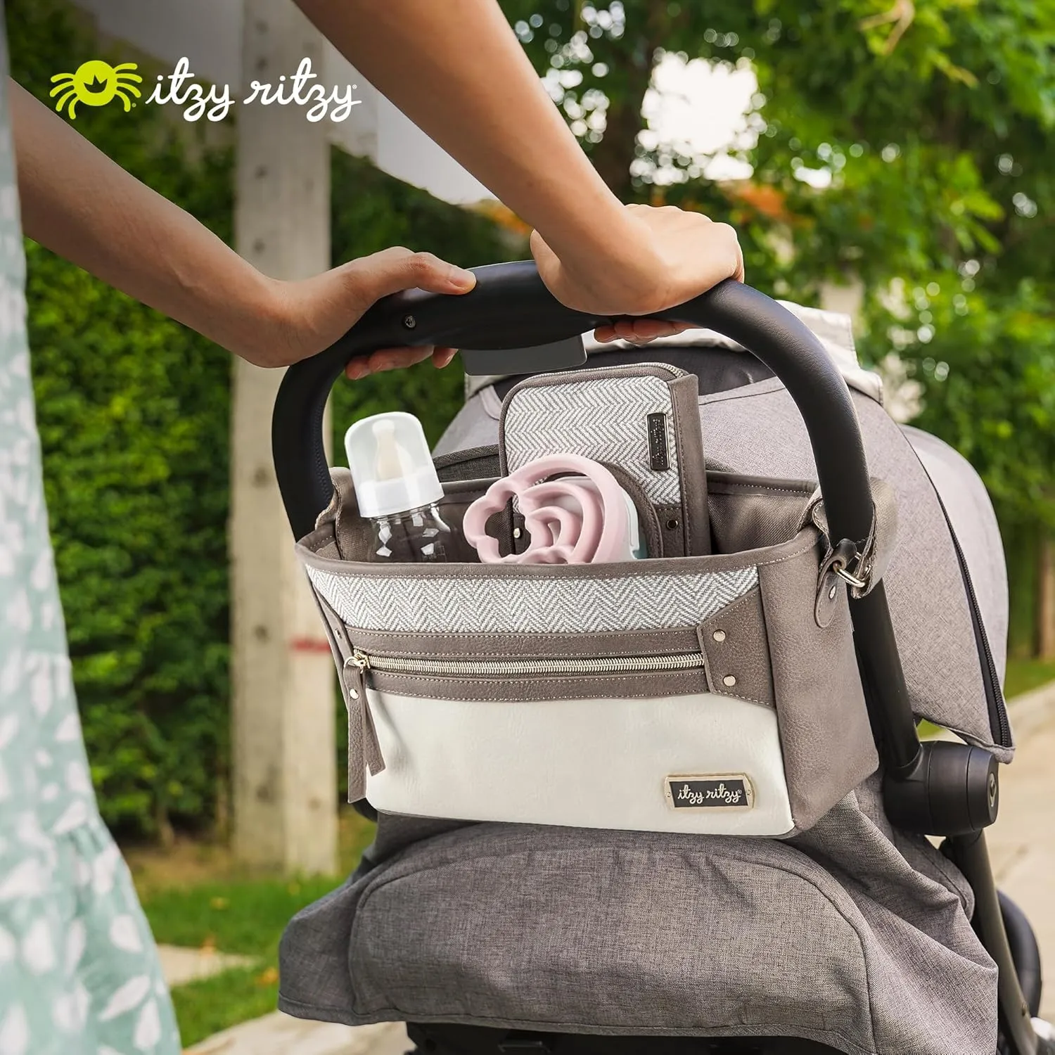 Itzy Ritzy Adjustable Stroller Caddy/Organizer - Stroller Organizer Bag Featuring Front Zippered Pocket, 2 Built-In Interior Pockets & Adjustable Straps to Fit Nearly Any Stroller (Vanilla Latte)